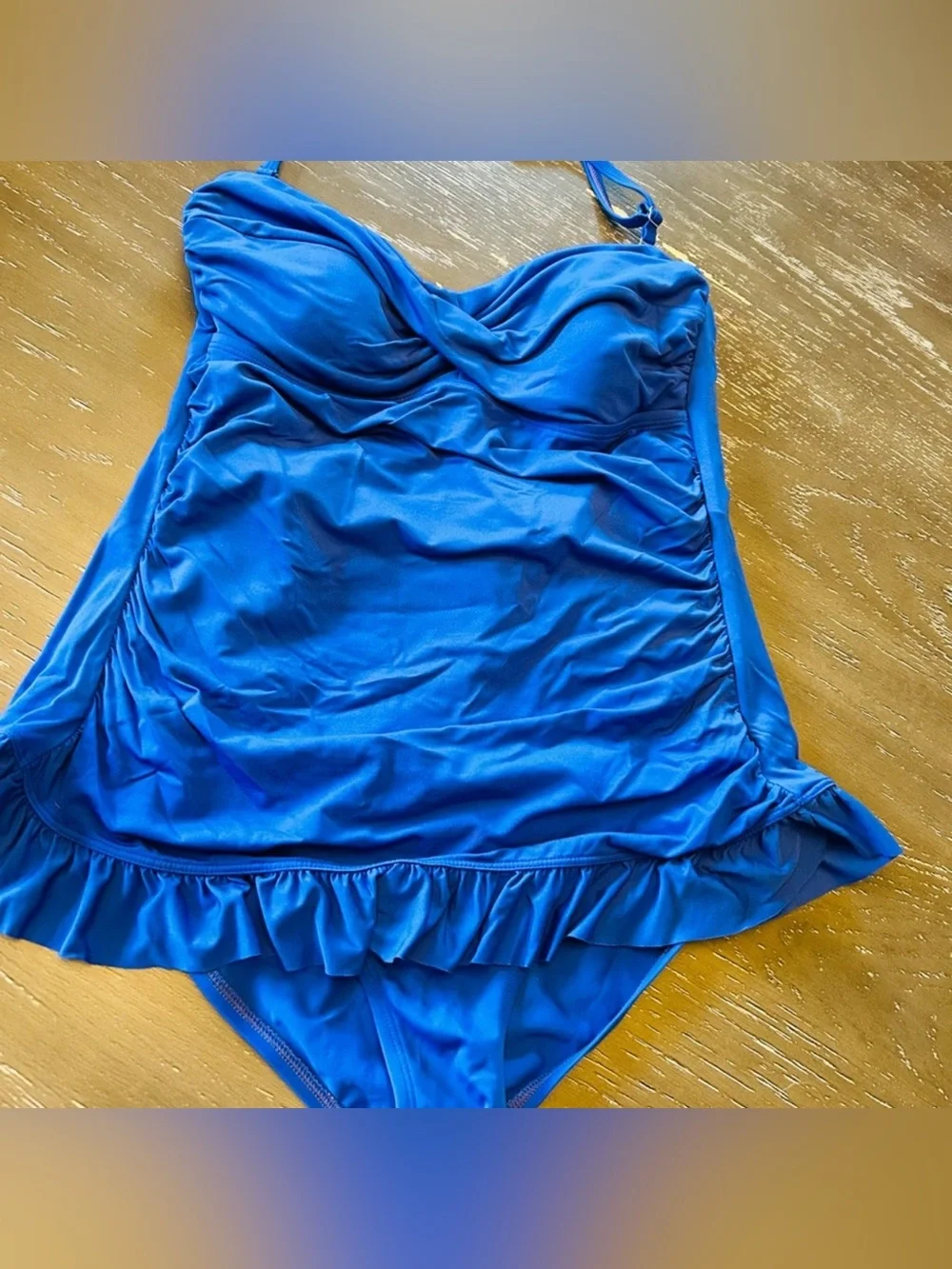 Beautiful blue one piece swimsuit.  Size 10. Very classy and cute!